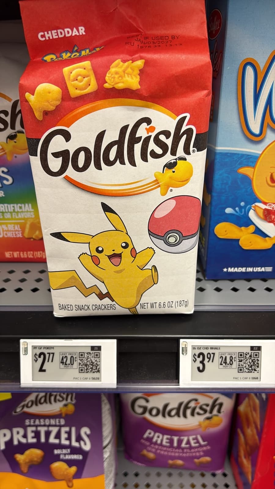 A supermarket shelf of Goldfish crackers in Pokémon packaging with Pikachu on the front